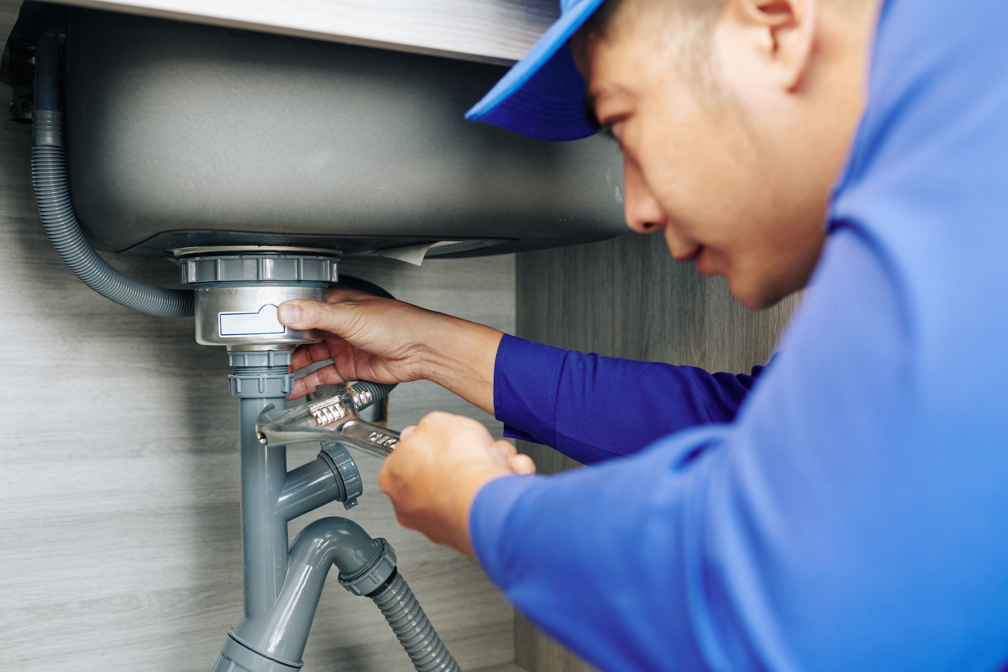 plumber-repairing-a-leaky-drain.jpg plumber-repairing-a-leaky-drain.jpg